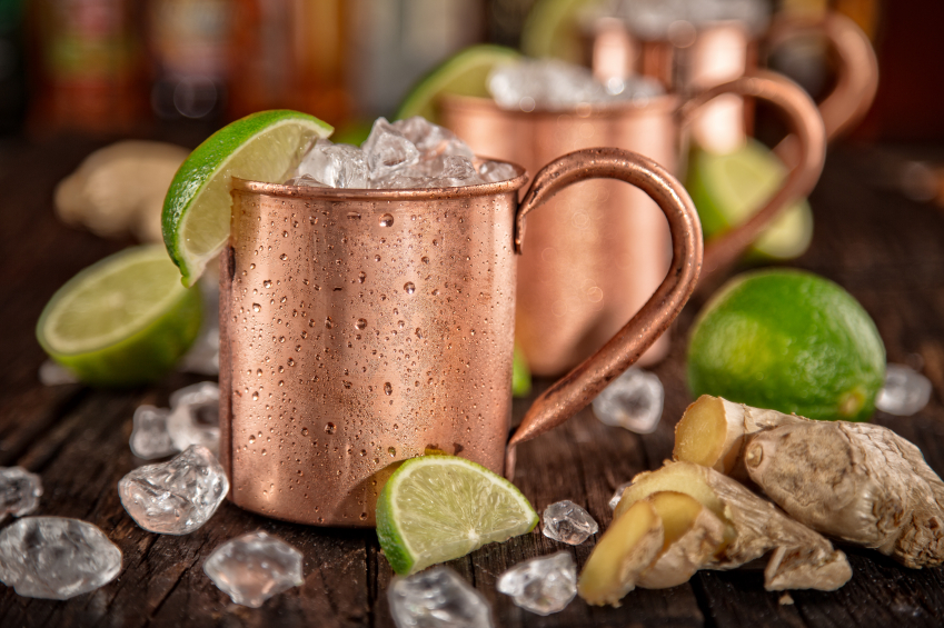 Cold Moscow Mules - Ginger Beer, lime and Vodka on bar